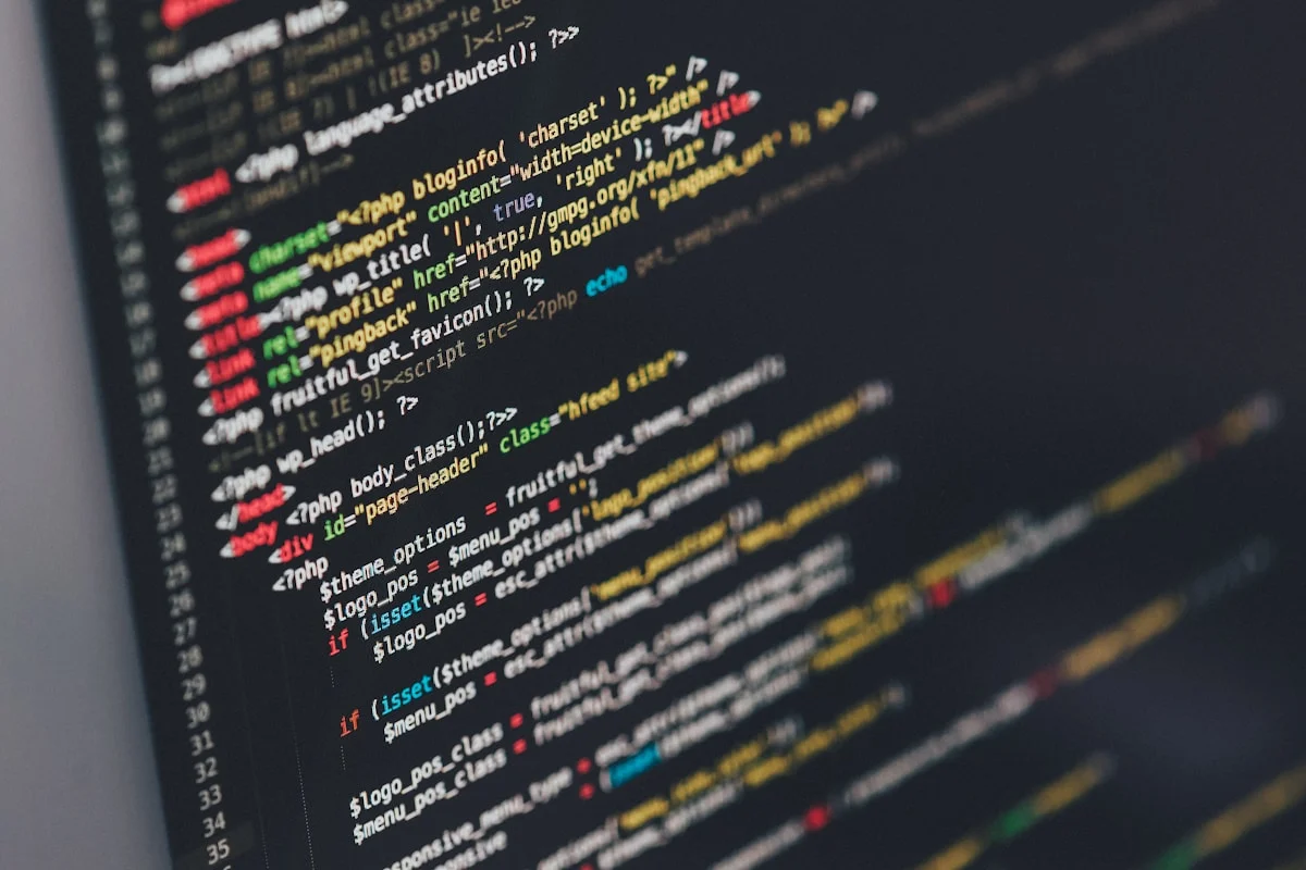 Code on a monitor in a dark room